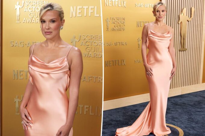 Милли Бобби Браун выглядит сияющим в платье из персикового скольжения на Sag Awards 2025 Красная ковровая дорожка